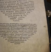 Photograph of the title page of the Bodleian Benefactors' Register, showing a paragraph set in italic type printed onto a large vellum page
